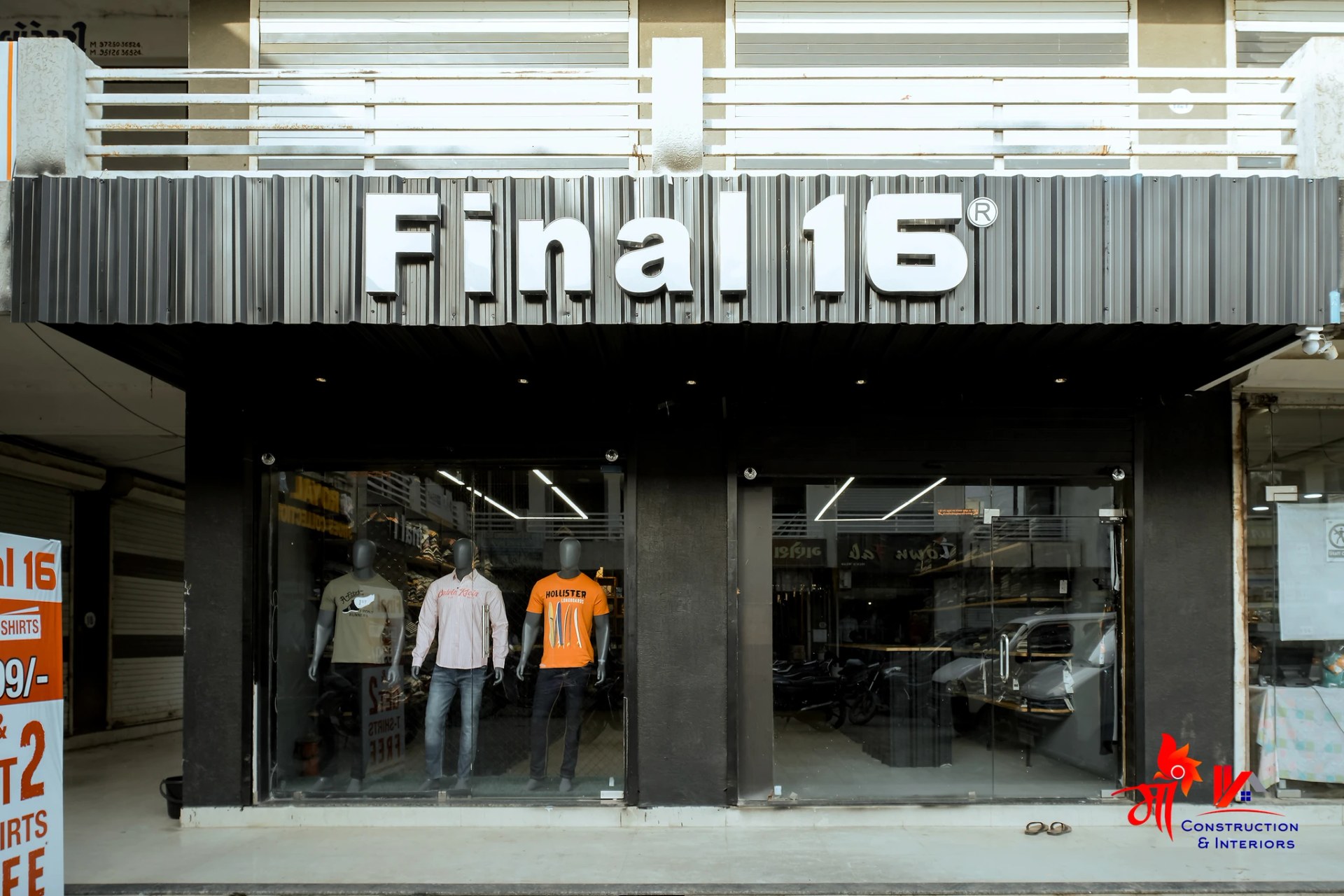 Boutique rail display inside black steel grid — 1