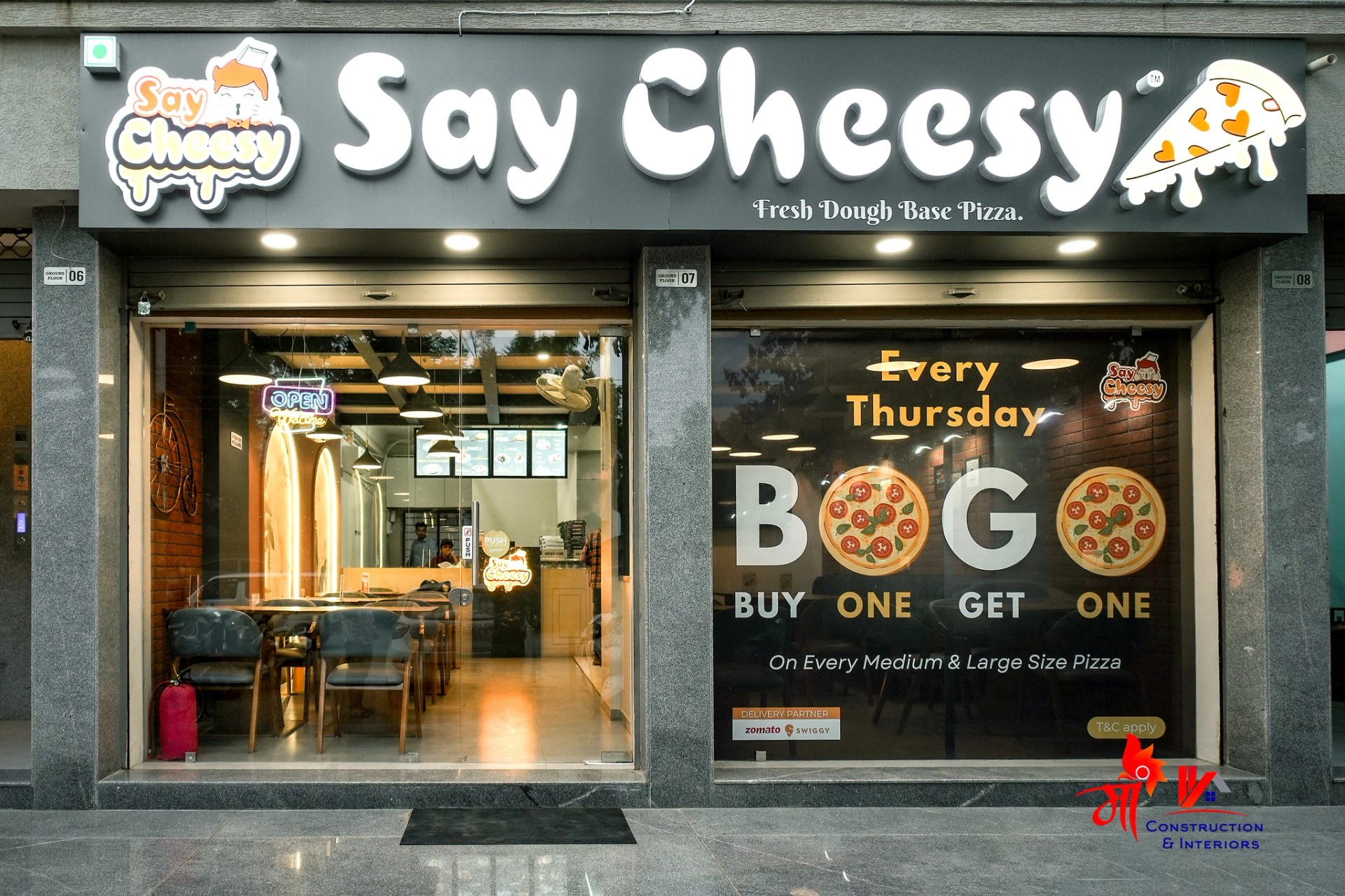 Cafe seating vignette in arched plaster shell — 1