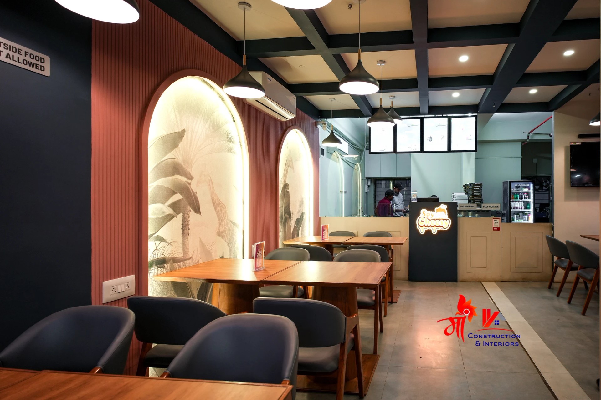 Cafe seating vignette in arched plaster shell — 2